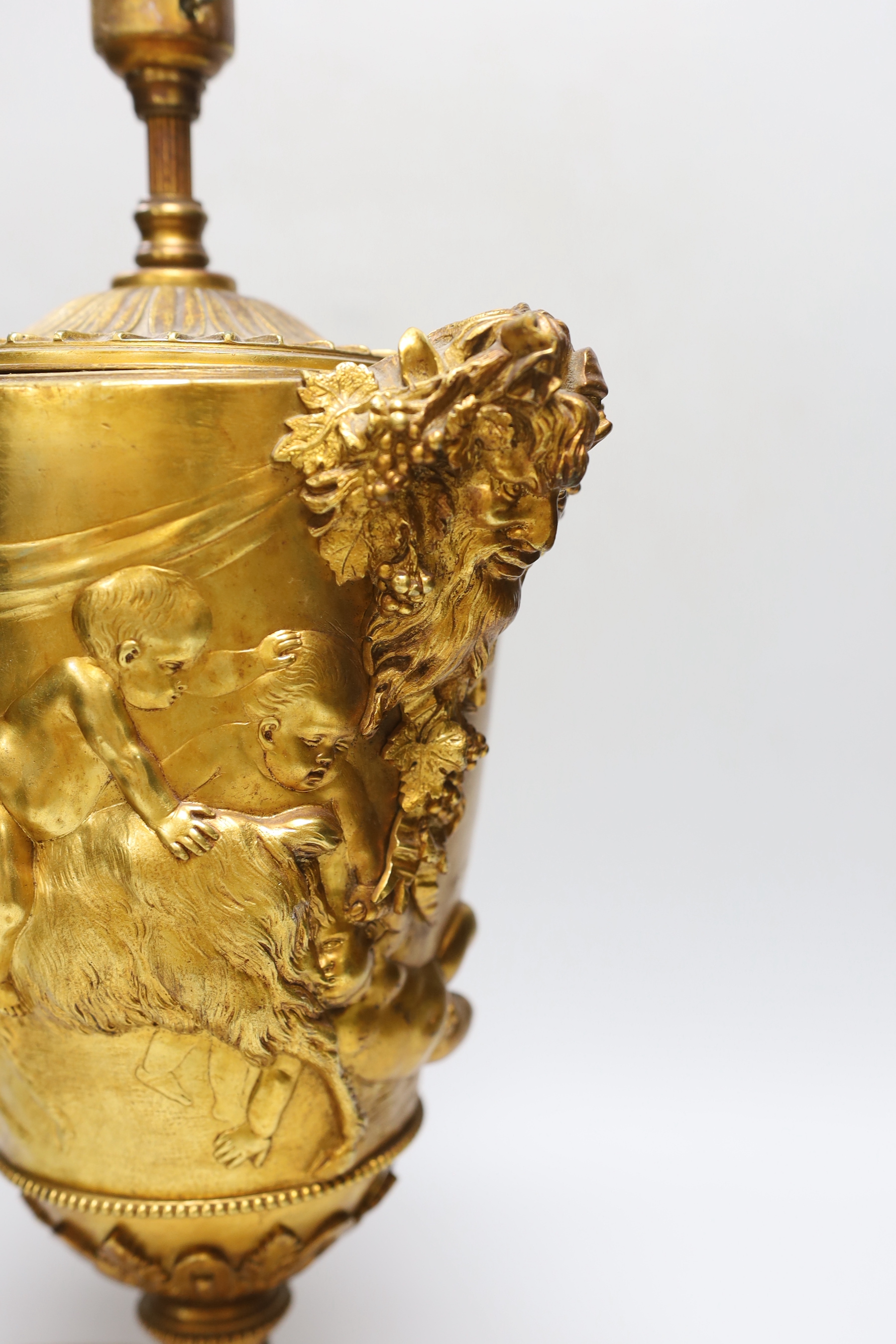 An ormolu urn shaped 'Bacchus' table lamp, 36cm high